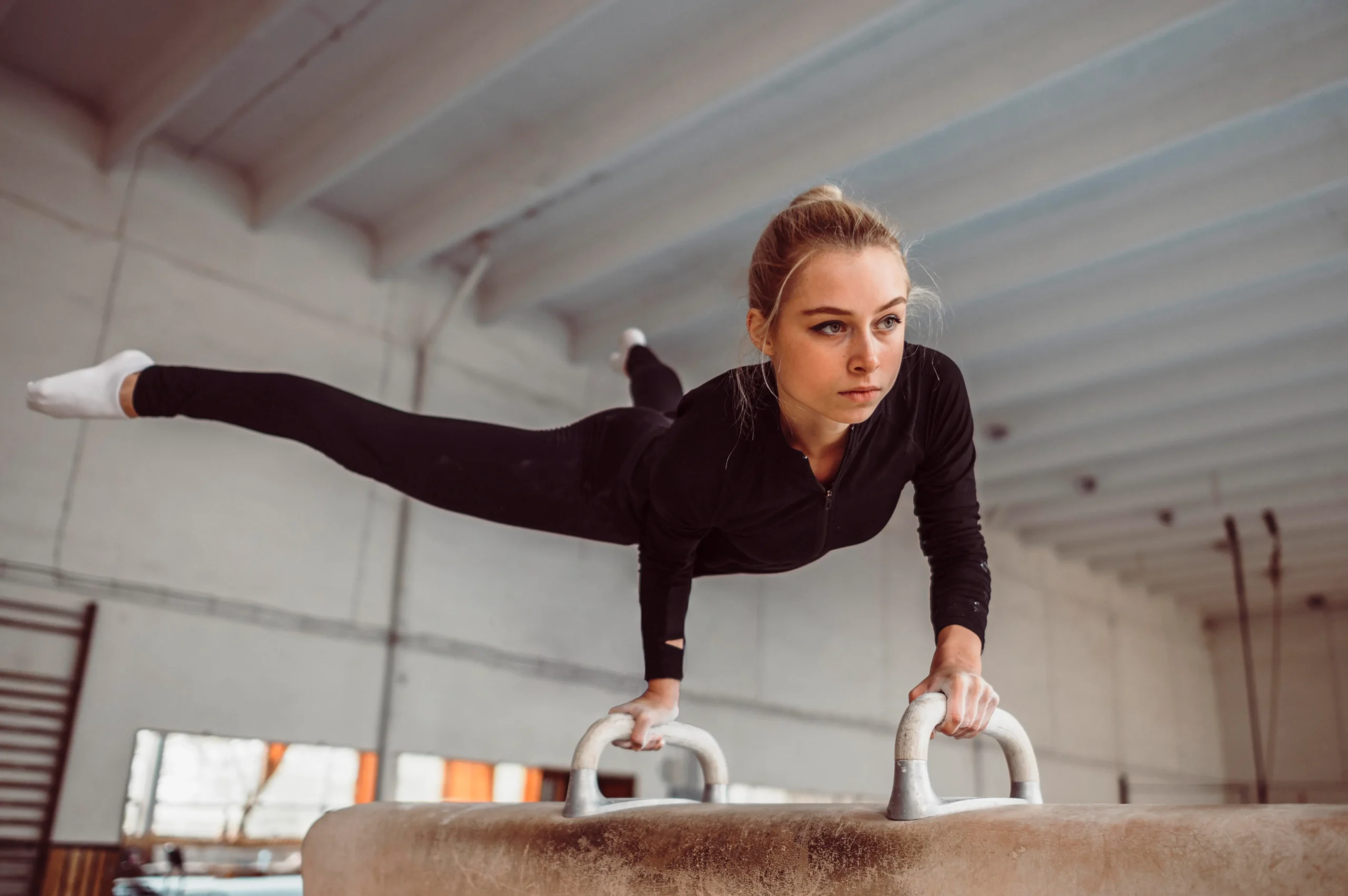 blonde woman training gymnastics championship scaled